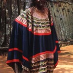 The Fon of Bafut standing in front of what he called his Father's House. The Fon was a powerful regional chief. Bafut, Cameroon, February 1965. 