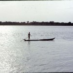 Man and canoe. River Niger, near Foge Island, Nigeria, May 1968. Foge Island was soon to be submerged by the construction of the Kainji Dam and the creation of Kainji Lake.