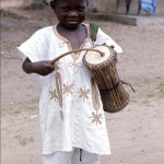 Young boy with talking drum, near Oke-Iho, Nigeria. 1968.