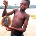 Boy with small ray at Bar Beach, Lagos, 23 May 1964.