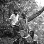 PICATHARTES 6. We set off from Eshobi to where Elias (centre standing) knew were areas of elevated and exposed rock-face deep in the forest. It is on these dry rock-faces that Picathartes builds its mud and fibre nest.