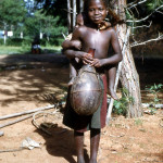 Young girl with baby and calabash, Bafut